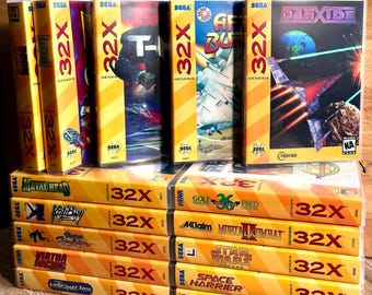 May include: A collection of Sega Genesis 32X video game cases arranged in two rows. The titles include After Burner, Darxide, Metal Head, Kolibri, Virtua Fighter, Virtua Racing, Motocross Championship, Golf Magazine 36 Great Holes, and Mortal Kombat II.