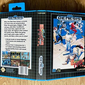 May include: A blue and black SEGA Genesis video game cartridge case for the game "Final Fight". The case features game art of characters fighting and text that reads "Final Fight" and "CAPCOM".