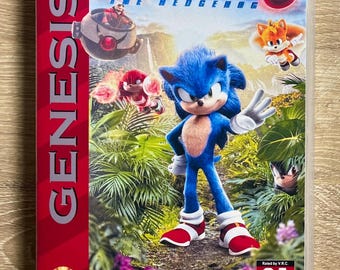May include: A SEGA Genesis game case for Sonic the Hedgehog 3. The cover features Sonic, Tails, and other characters in a jungle setting. The case is red and has the SEGA logo.