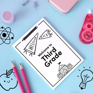 May include: A white card with black text and illustrations. The text reads "Welcome to Third Grade". The illustrations include a welcome back banner, a school building, a lightbulb, and an apple.