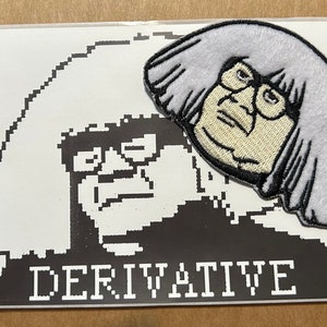 May include: An embroidered patch featuring a cartoon face with glasses and gray hair, placed on a white rectangle with a black and white pixelated image of the same face. The word "DERIVATIVE" is printed in white.
