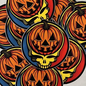 May include: A set of round stickers featuring a cartoon skull with a pumpkin face. The skull is yellow with black eyes and a black mouth. The pumpkin is orange with a black stem and a black face. The stickers are on a white background.