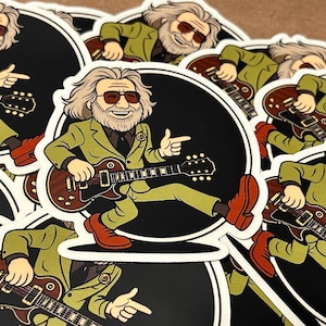 May include: A collection of stickers featuring a cartoon illustration of a man playing a guitar. The man is wearing a green suit, red shoes, and sunglasses. The guitar is brown. The stickers have a black background and a white border.