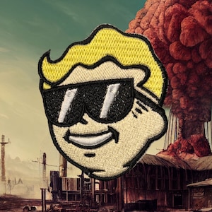 May include: Embroidered patch featuring a cartoon character with yellow hair and sunglasses. The character has a smiling expression. The patch is set against a background of a post-apocalyptic landscape with a mushroom cloud.