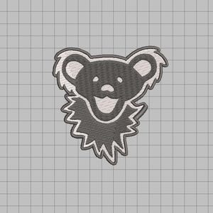 May include: Embroidered patch featuring a stylized bear face with a smiling expression. The bear is primarily gray with white accents on the ears, mouth, and jagged collar. The patch is designed for application on clothing or accessories.