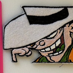 May include: A white ceramic mug with a black handle and the text "But First, Coffee" in a black, bold font. The mug is sitting on a white surface. The mug is approximately 4 inches tall.