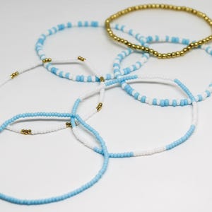 Eye-Catching Stack of Beaded Bracelets in UNC Tar Heels Colors - UNC Tar Heels Jewelry