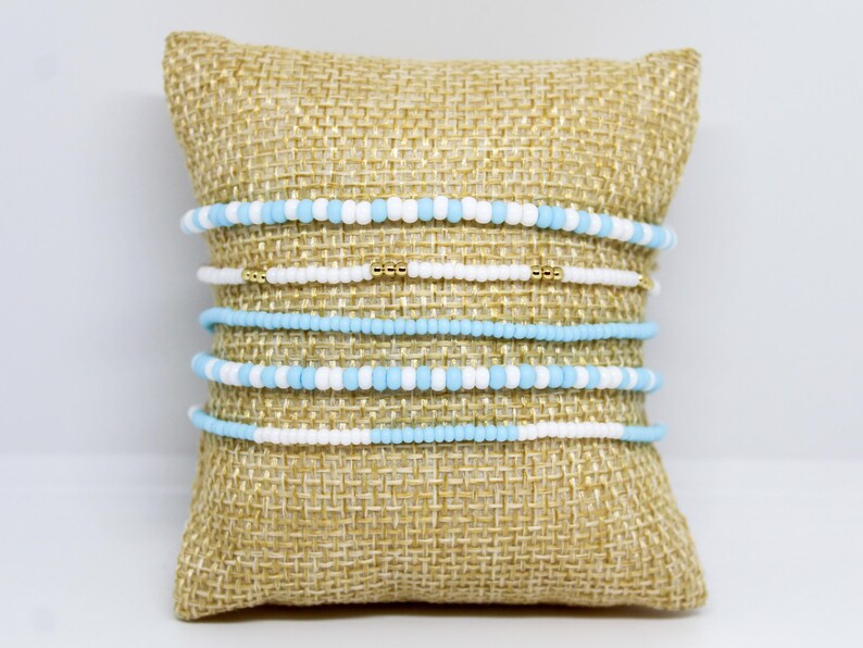 Elegant Stack of Light Blue and White Beaded Bracelets with Hints of Gold - UNC Tar Heels Beaded Bracelets