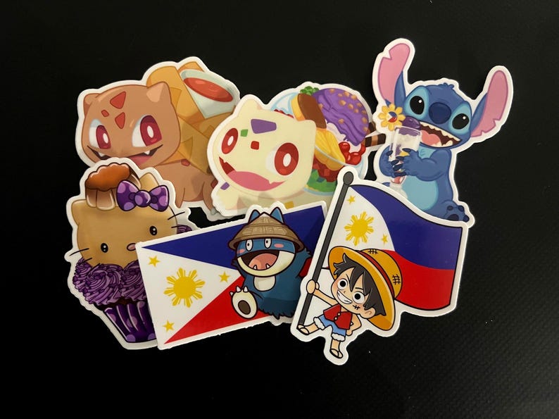 May include: A collection of colorful stickers featuring cartoon characters like Bulbasaur, Stitch, and Hello Kitty. The stickers also include images of the Philippine flag and a character from One Piece. The stickers are on a black background.