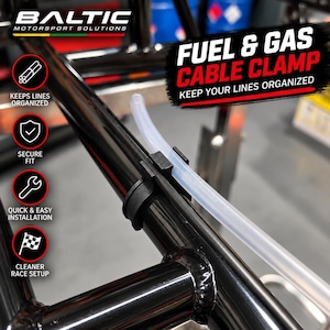 May include: A black plastic fuel and gas cable clamp attached to a black metal frame, holding a clear flexible tube. Text on the image reads BALTIC MOTORSPORT SOLUTIONS, FUEL & GAS CABLE CLAMP, KEEPS LINES ORGANIZED, SECURE FIT, QUICK & EASY INSTALLATION, CLEANER RACE SETUP.