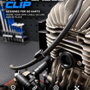 Può includere: Una clip per cavo RPM nera fissata su un cavo nero di un motore per kart. Il testo recita: BALTIC MOTORSPORT SOLUTIONS, RPM CABLE CLIP, DESIGNED FOR GO KARTS, KEEPS YOUR RPM CABLE SECURE AND IN PLACE, CLEAN INSTALLATION, DURABLE 3D PRINTED, FITS MOST KART SETUPS, EASY INSTALLATION, BUILT BY ENTHUSIASTS. FOR RACERS.
