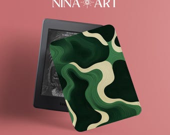 May include: A black e-reader with a green and beige patterned cover. The cover features a layered, abstract design. The text "NINA-ART" is displayed in white at the top of the image.