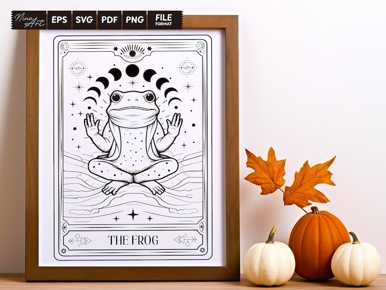 May include: A black and white illustration of a frog sitting in a meditative pose with a crescent moon above its head. The image is framed in a brown wooden frame and has the text "THE FROG" at the bottom.