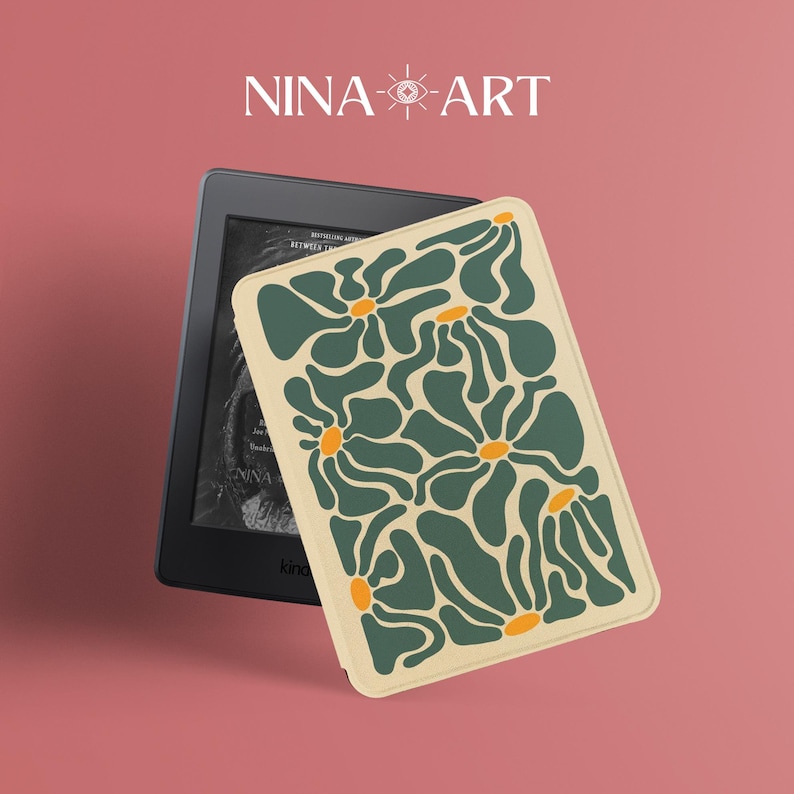May include: A black e-reader with a cream-colored case featuring a green floral pattern with orange centers. The case is rectangular and covers the e-reader. The text "NINA-ART" is displayed in white at the top of the image.
