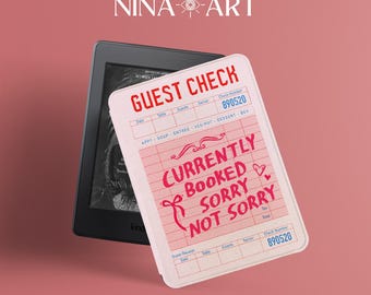 May include: A pink guest check with the text "CURRENTLY BOOKED SORRY NOT SORRY" and a Kindle e-reader. The guest check has a vintage design with a check number of 890520. The background is a solid pink color.