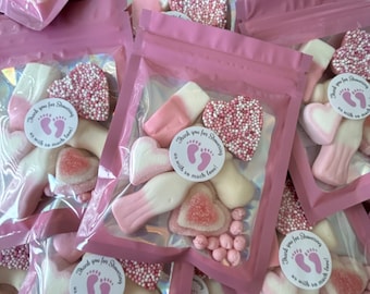 May include: Pink and white candy in clear plastic bags with pink and white labels that say "Thank you for Showering us with so much love!"