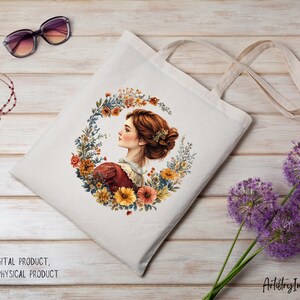 May include: A white tote bag with a floral design featuring a woman with brown hair and a wreath of flowers. The bag has a long strap and is made of canvas.