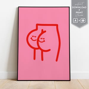May include: A framed art print featuring a minimalist illustration of a rear end with smiling faces. The artwork is rendered in red on a pink background. The print includes the text "instant download + print at home".
