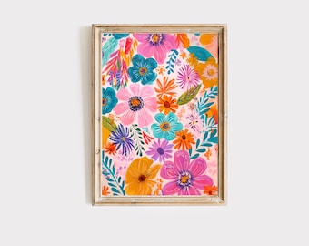 May include: A framed print featuring a colorful floral pattern with pink, orange, yellow, blue, and purple flowers on a light pink background.