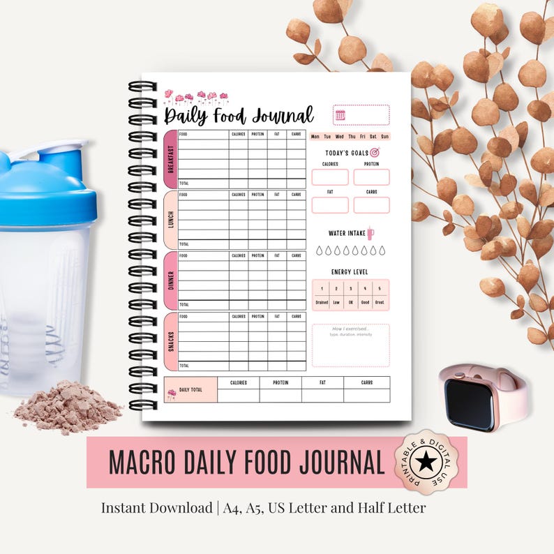 Aesthetic flat lay of macro food journal PDF on printed binder with text overlay that reads “Macro Daily Food Journal".