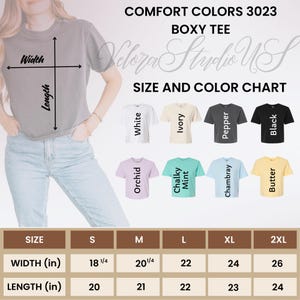 May include: A size and color chart for Comfort Colors 3023 Boxy Tee shirts. The chart shows the width and length measurements in inches for sizes S to 2XL. Colors include white, ivory, pepper, black, orchid, chalky mint, chambray, and butter.