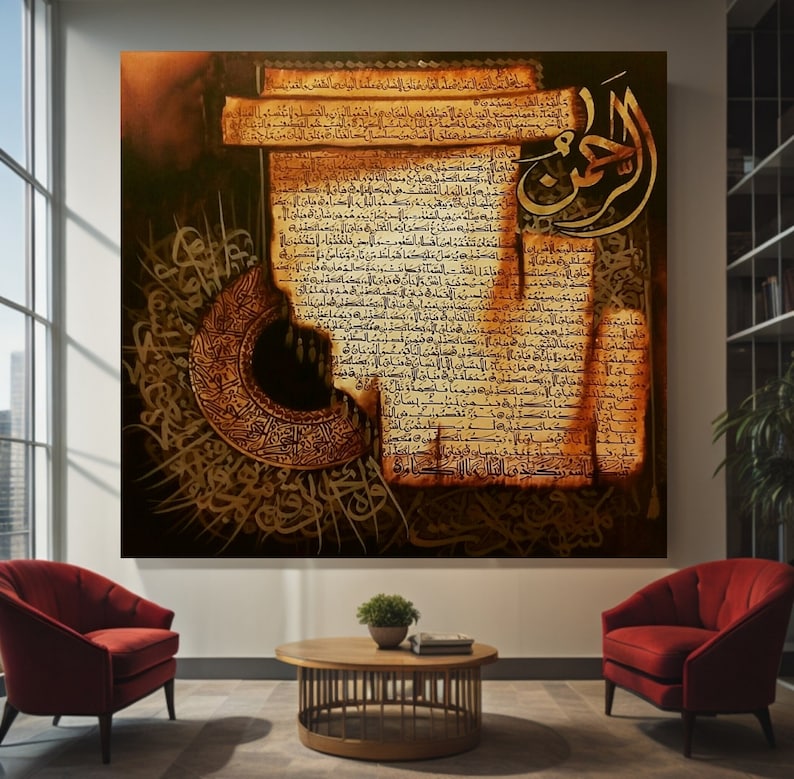 May include: Large framed artwork featuring Arabic calligraphy in gold and brown tones. The artwork depicts intricate script on a parchment-like background, with a circular design on the left. The piece is displayed in a modern living room setting with red chairs.
