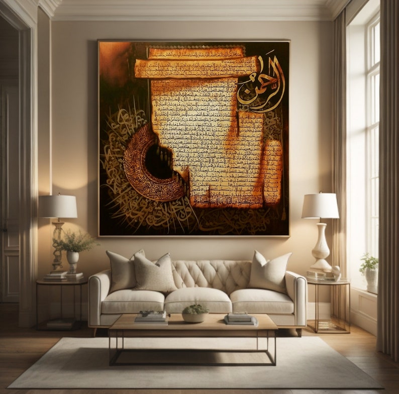 May include: A large framed artwork with Arabic calligraphy in brown and gold tones. The piece has a vintage aesthetic, with detailed script and decorative features. It hangs above a cream sofa in a bright living room, creating a focal point.