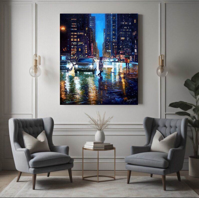 May include: A painting of a city street at night with cars and a person walking in the rain. The street is wet and reflecting the lights of the buildings. The buildings are tall and have many windows. The painting is done in a realistic style.