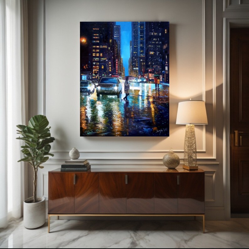 May include: A painting of a city street at night with cars and people walking. The street is wet from rain and the lights of the buildings are reflected in the puddles. The painting is done in a realistic style with a focus on the details of the city.