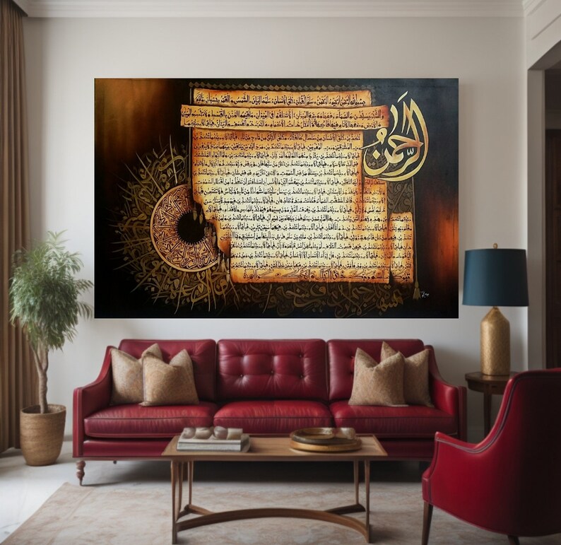 May include: Large framed artwork with gold and brown Arabic calligraphy. The artwork has a dark background with a circular design and text resembling aged parchment. It is displayed above a red leather sofa in a living room.