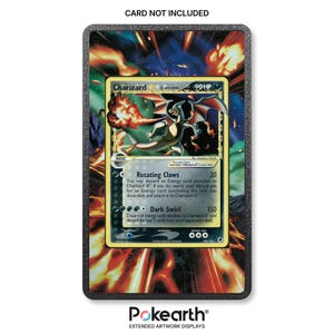 May include: A rectangular black display frame featuring an extended artwork background of orange and yellow flames. Centered inside is a Charizard trading card with 90 HP, displaying the attacks Rotating Claws and Dark Swirl with black text.