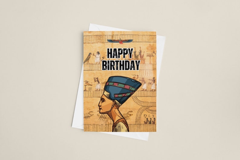 May include: A greeting card with an Egyptian theme. The card features a drawing of an Egyptian woman wearing a blue headdress and a gold necklace. The background is a tan colour with hieroglyphics and other Egyptian symbols. The text "Happy Birthday" is printed in black letters on the card.
