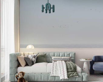May include: A light blue tufted bed with a white and green patterned blanket and pillows. A stuffed monkey sits on the floor in front of the bed. A blue and white rug is on the floor. A light blue pendant light hangs from the ceiling.
