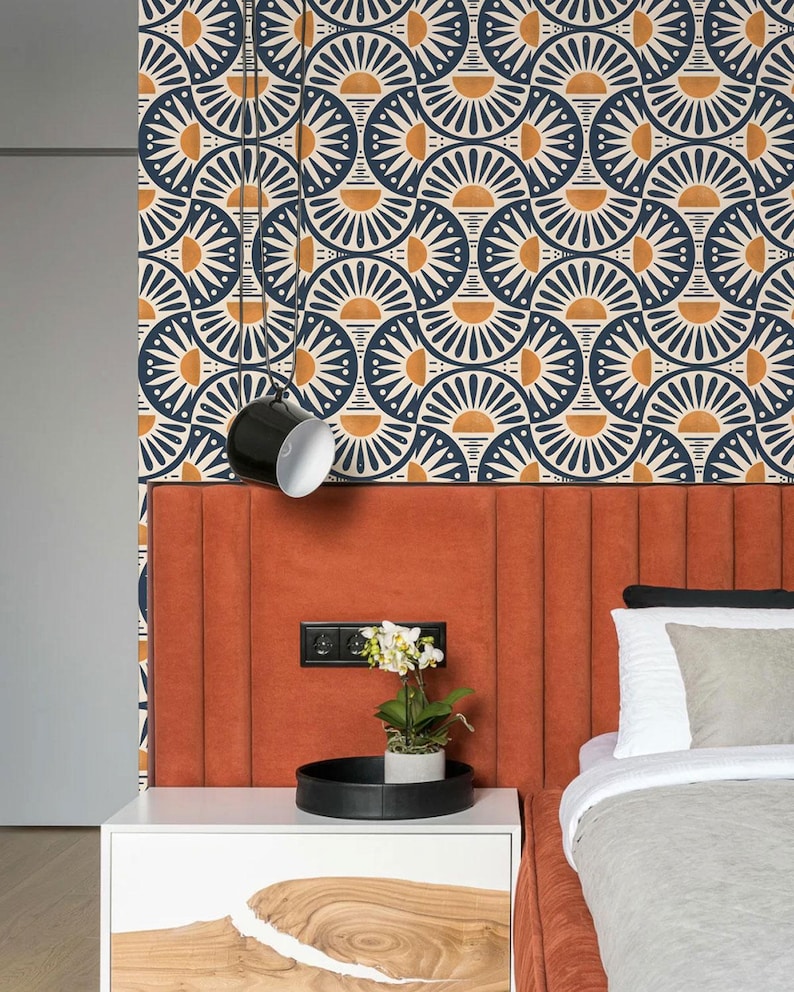 May include: Wallpaper featuring a repeating geometric pattern of dark blue and orange semicircles arranged in a fan-like motif. The design consists of alternating dark blue and orange arcs on a cream background, creating a structured, symmetrical visual.