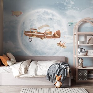 Сhildren's high quality wallpaper with airplane and moon for a kids room. Blue wall covering for boy or girl.