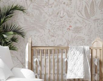 May include: A white crib with a white quilted blanket and a white ruffle skirt. The crib is in front of a wall with a beige wallpaper featuring a delicate floral pattern with brown outlines.