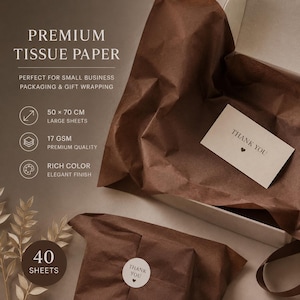May include: Dark brown tissue paper sheets in a box with a thank you card and sticker. Text reads: PREMIUM TISSUE PAPER, 50 x 70 CM, 17 GSM, RICH COLOR, 40 SHEETS. The paper is thin and crinkled, used for packaging and gift wrapping purposes.