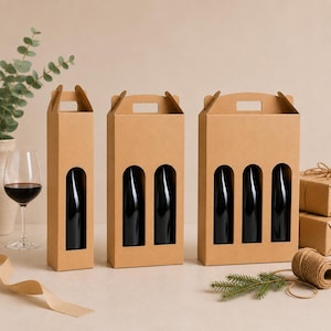 May include: Three brown cardboard wine bottle carriers, each with a handle and arched cutouts to display the bottles. The carriers hold one, two, and three dark wine bottles. A wine glass with red wine is visible.