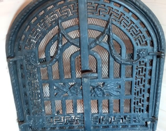 Cast iron art deco openwork fireplace door, made circa 1940s.