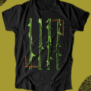 May include: Black t-shirt featuring a green thorn design with the words "TYPE O NEGATIVE" and "OCTOBER RUST" in orange. The design consists of four vertical lines with thorns.