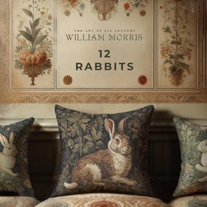 May include: A throw pillow with a dark green background featuring a detailed illustration of a brown rabbit in a forest setting. The pillow has the text "The Art of XIX Century William Morris 12 Rabbits" printed on it.
