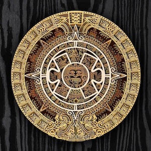 May include: A circular, intricate design with a central face and concentric rings of geometric patterns. The design is in shades of gold and brown, with a dark background.