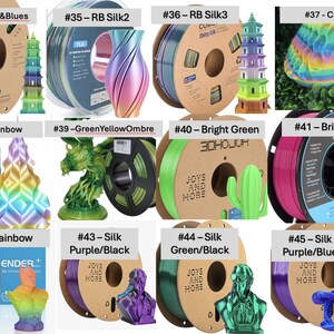 May include: A collection of twelve 3D printer filament spools labeled #34 through #45, featuring various colors including rainbow, silk purple, bright pink, and green. Each spool is displayed alongside a 3D printed object such as a pagoda, vase, or bust.