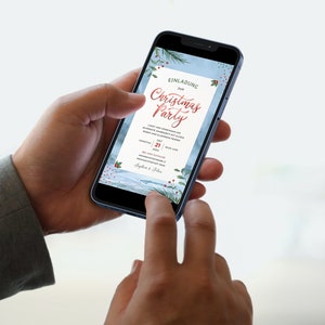 May include: A smartphone displaying a digital Christmas party invitation with a watercolor background featuring pine branches and red berries. The invitation reads "Einladung 2018 Christmas Party".