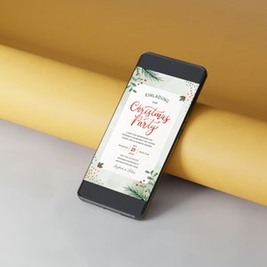 May include: A smartphone displaying a Christmas party invitation with a green and red watercolor design. The invitation reads "Einladung zur Christmas Party" and includes the date "21.12.2023".