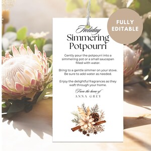 May include: A white tag with the text "Holiday Simmering Potpourri" and instructions. The tag is decorated with a floral arrangement and the words "From the home of ANNA GREY". A circular label reads "FULLY EDITABLE".