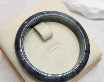 Wu Ji Classic Cut 56.5mm Round Bangle w yellow surface dent- Authentic Grade A Burmese Jadeite (翡翠). Certificate of Authenticity Included.