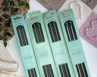 May include: Four packages of Knit Pro Mindful Collection single point knitting needles in stainless steel. The needles are packaged in green and blue boxes with the size and length printed on the front. The needles are 3.25 mm (US 3), 4 mm (US 6), 4.5 mm (US 7) and 5 mm (US 8) in size.