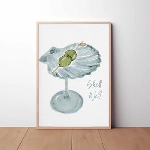 May include: A watercolor painting of a martini glass with a shell for a bowl. The glass is filled with green olives and the text "Shell We?" is written below the glass.