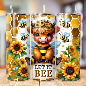 May include: A stainless steel tumbler with a colorful design featuring a cartoon highland cow dressed as a bee. The tumbler has a straw and the design includes sunflowers, bees, and honeycomb. The text "Let it Bee" is printed on the tumbler.